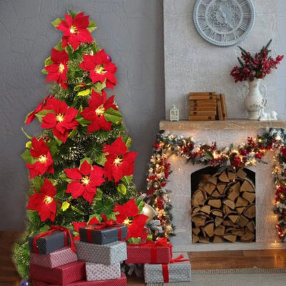 Poinsettia wreath decoration, adorned with red berries and holly leaves